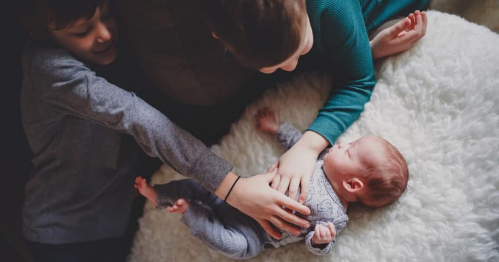 newborn and siblings