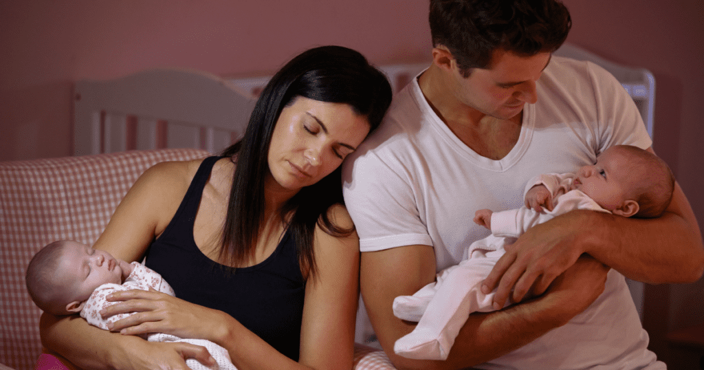 Expecting twins, mother and father holding baby twins