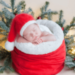 Surviving the holidays with a newborn, newborn baby in a Santa hat