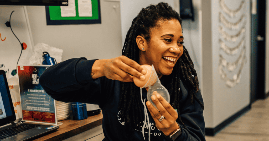 Breastfeeding Class Instructor showing how to use a haakaa breast pump