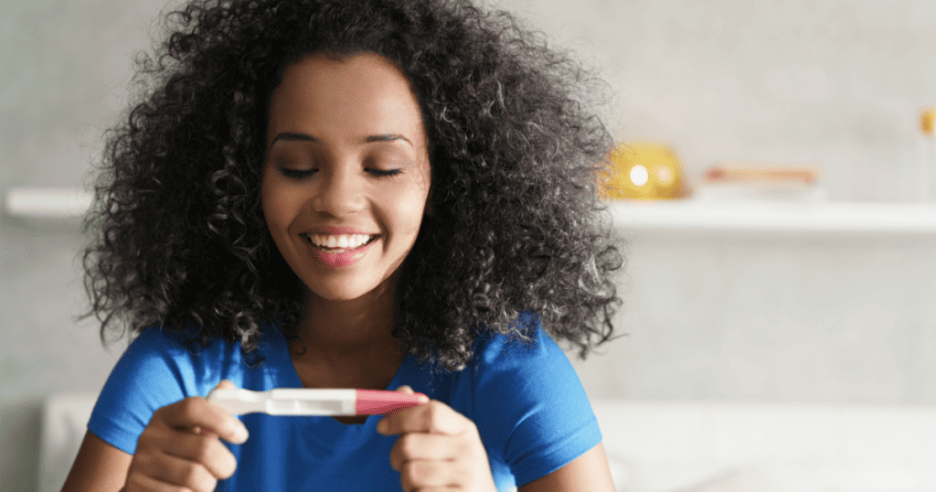 Mom looking at pregnancy test