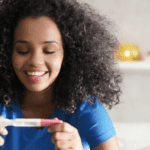 Mom looking at pregnancy test