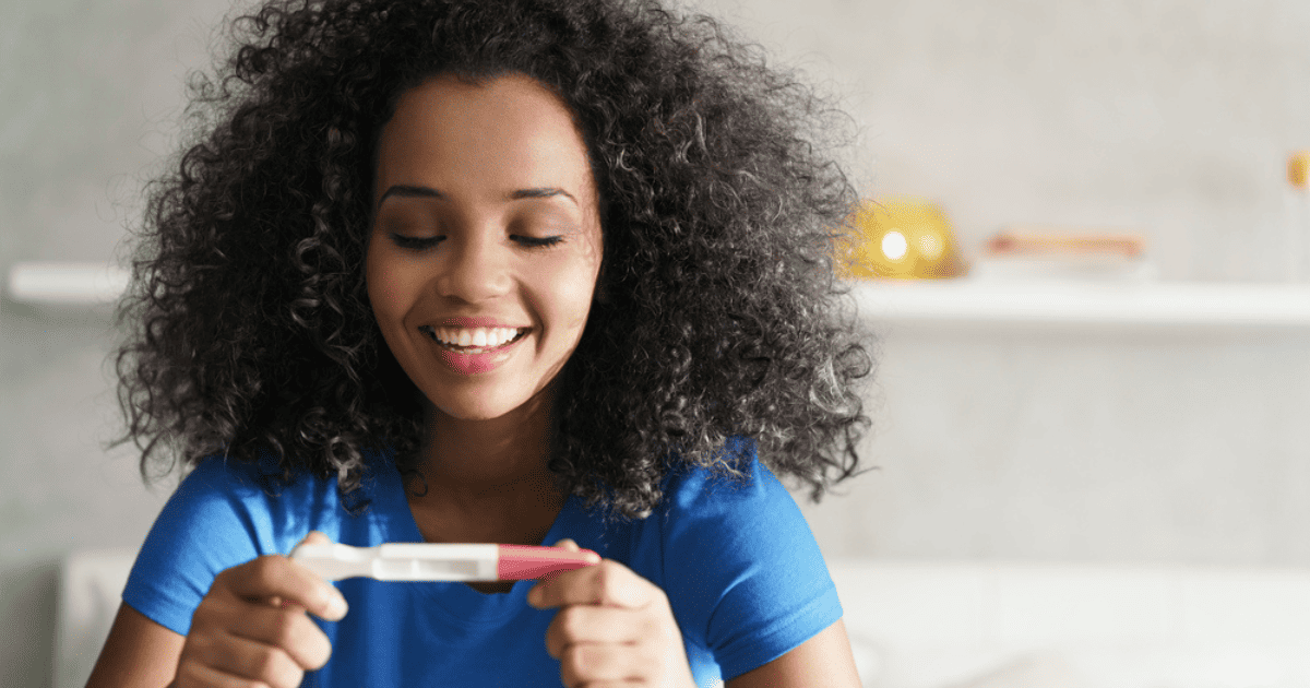 Mom looking at pregnancy test