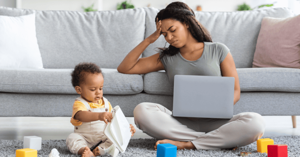 A Mom Holding her Hand to her head - "Mommy Brain"