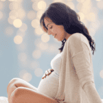 Pregnant Mom looking at belly - prodromal labor