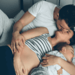 Intimate Connection With Partner, Mom and Dad kissing, baby lying next to them