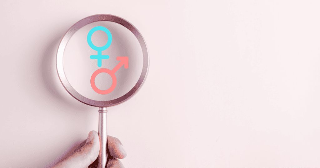 Gender disappointment, magnifying glass looking at boy or girl symbol