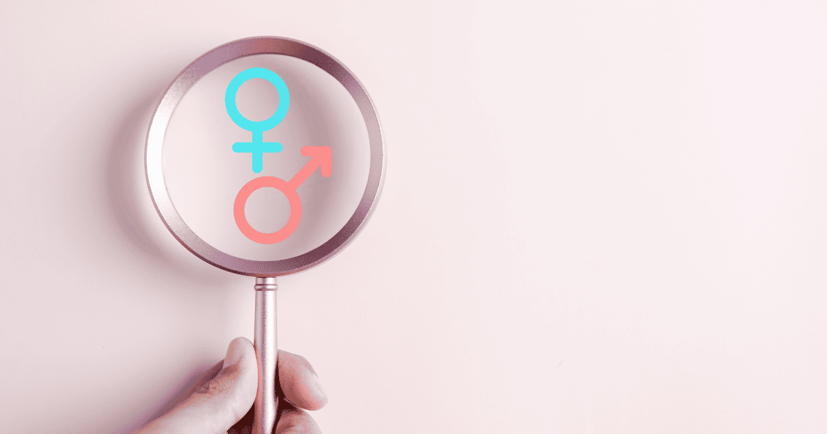 Gender disappointment, magnifying glass looking at boy or girl symbol