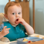 Baby Eating in his highchair, Tips for Weaning from Breastfeeding