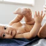 diaper rash treatment, mom putting ointment on baby bottom