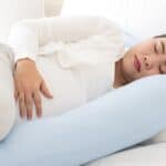Pregnant Mom lying in bed, PCOS and Pregnancy