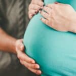 maternal bonding, hands on pregnant belly