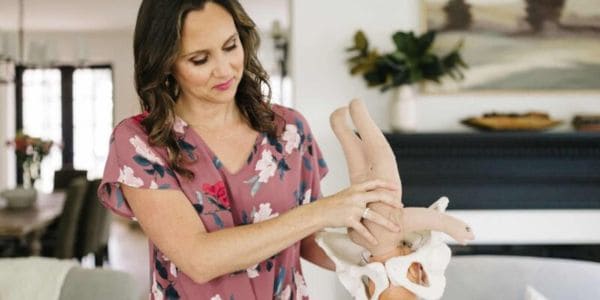 Owner of Buddha Belly Birth Christie Rinder teaches birth class with baby model and pelvis