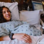 woman in hospital bed being induced for labor