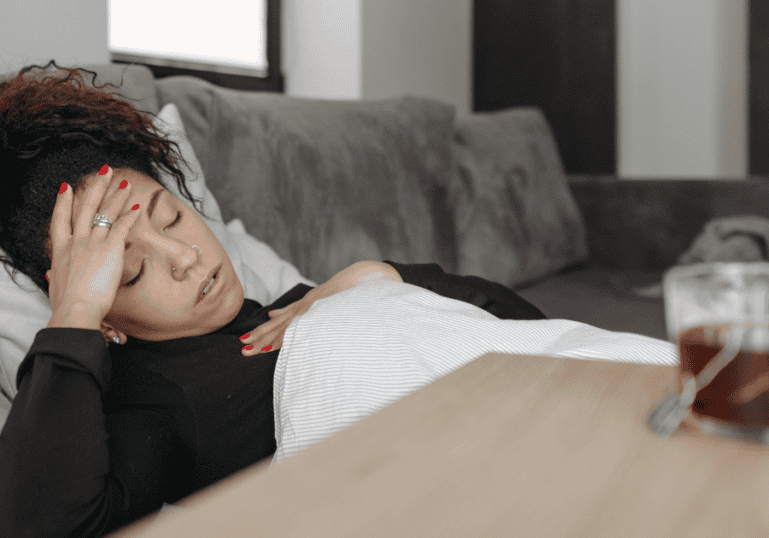 Mom laying down, feeling sick, morning sickness