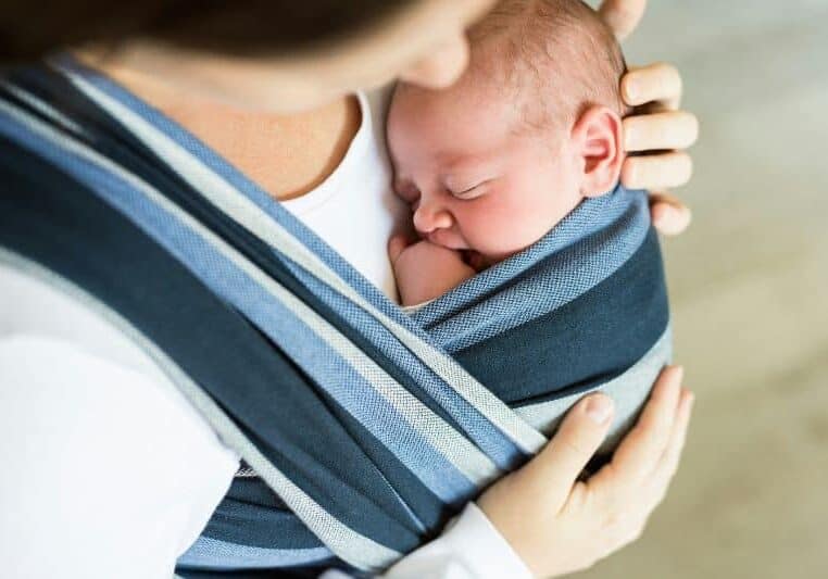 Doula holding baby