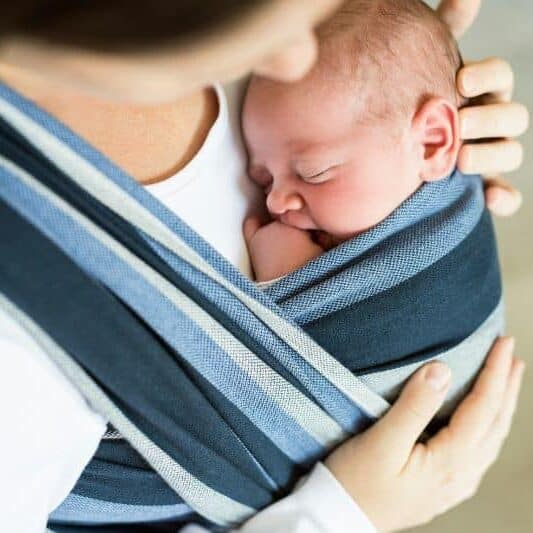 Doula holding baby