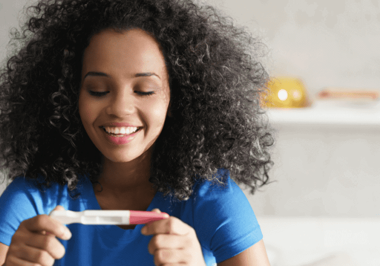 Mom looking at pregnancy test