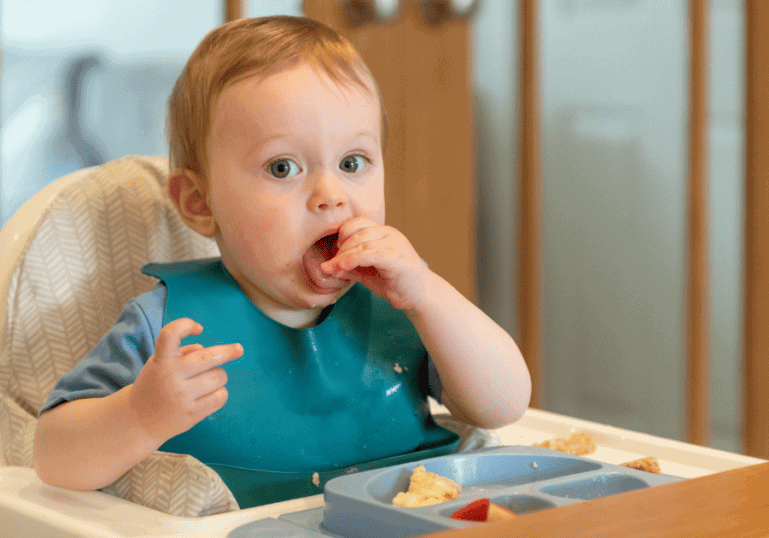 Baby Eating in his highchair, Tips for Weaning from Breastfeeding