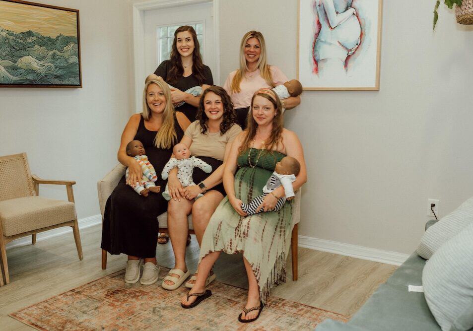 group of five women after a newborn care class at buddha belly doulas in tampa, fl