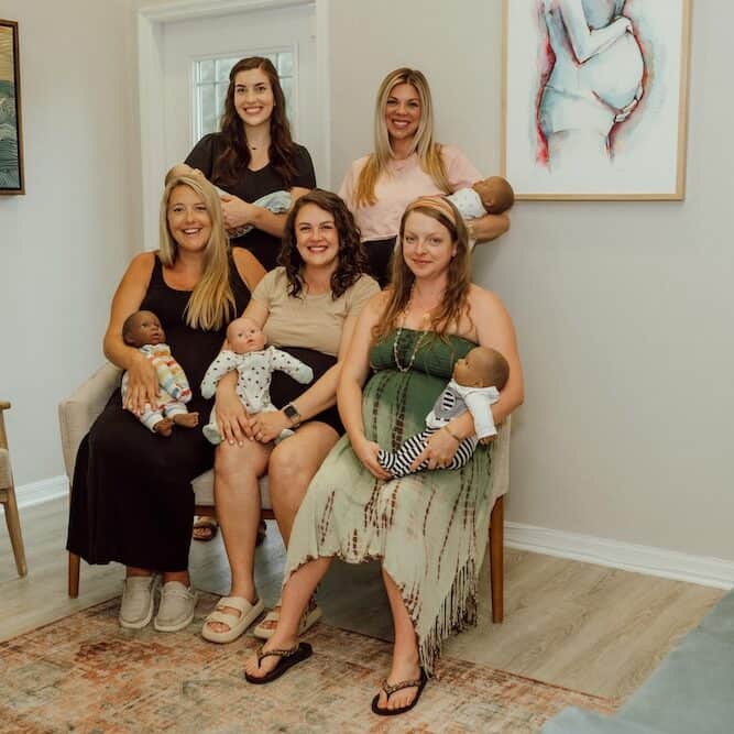 group of five women after a newborn care class at buddha belly doulas in tampa, fl