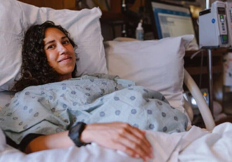 woman in hospital bed being induced for labor