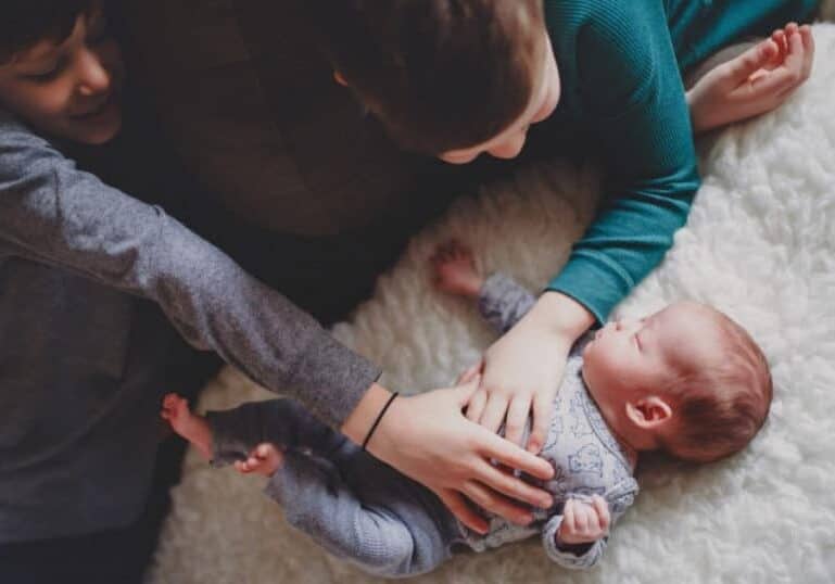 newborn and siblings