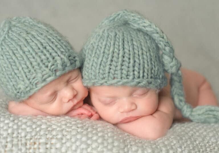 twin newborns sleeping